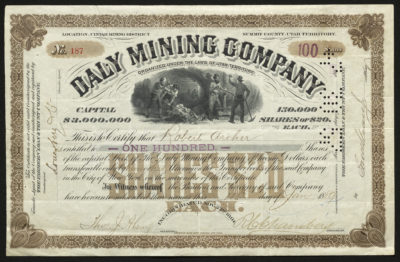 Certificate with black and brown ink shows intricate lettering, signatures, a punched-out date stamp, and a vignette with miners and mining carts