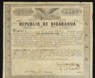 Certificate with black ink shows intricate borders, lettering, signatures, and vignettes of an eagle, ship, city, and train