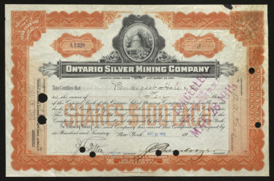 Certificate with black and orange ink shows intricate borders, lettering, a vignette with flowers surrounding a small wooden structure